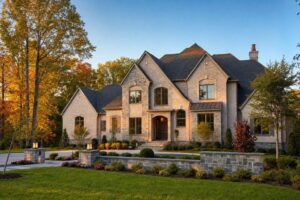 Stately Northern Virginia custom home exterior in early autumn at golden hour