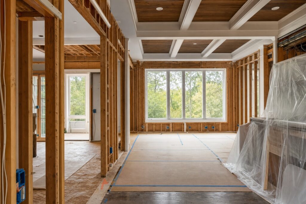 Home interior mid-renovation with exposed framing - Valor Builder